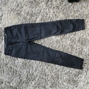 Black skinny coated denim